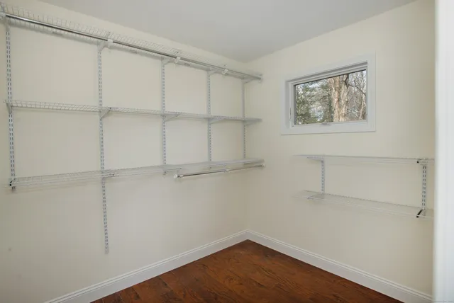 a view of a room with shelf on the wall