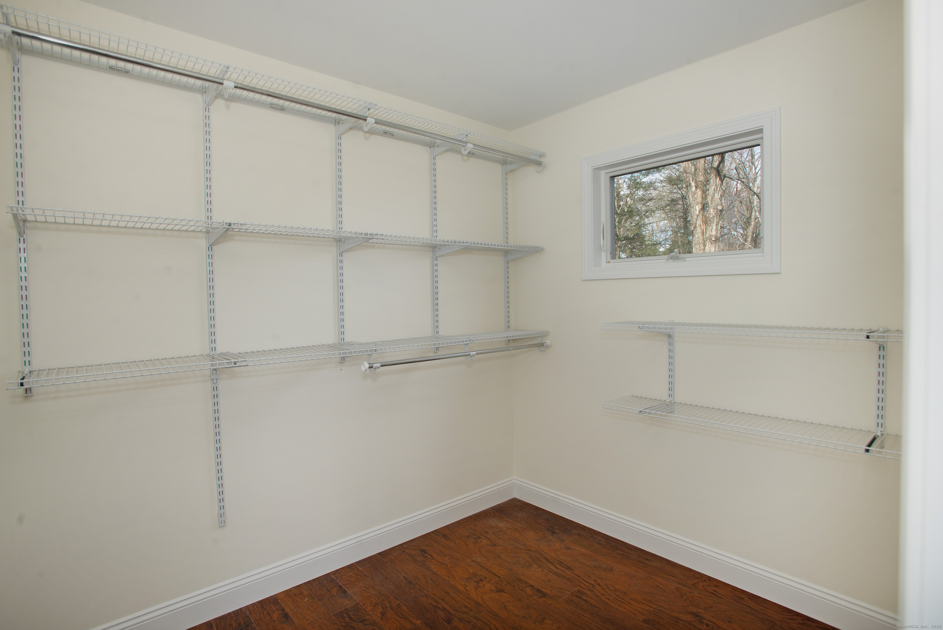 180 Peaceable Ridge Road Ridgefield, CT 06877 - Photo 19 of 28 a view of a room with shelf on the wall