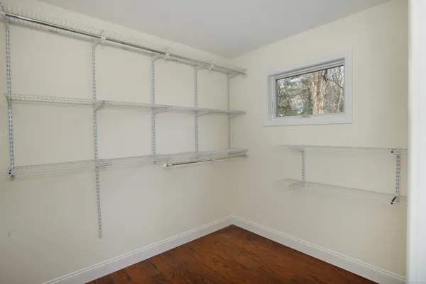 a view of a room with shelf on the wall