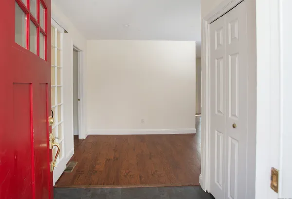 an entryway with wooden floor