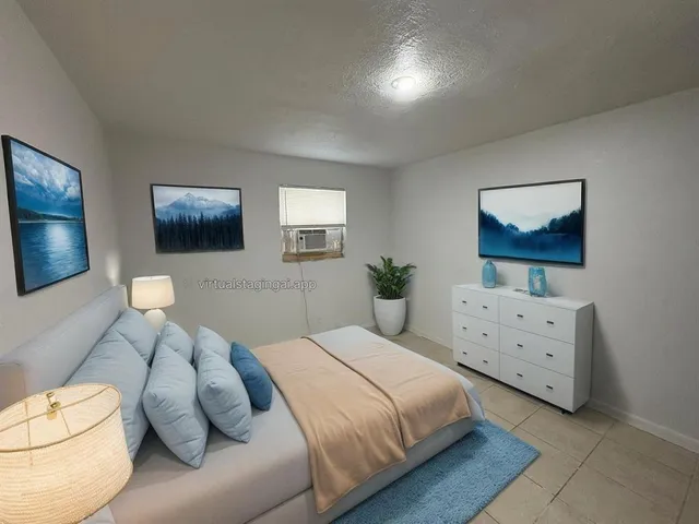 a bedroom with a bed and a couch