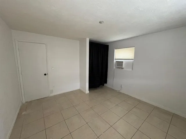 a view of an empty room with windows