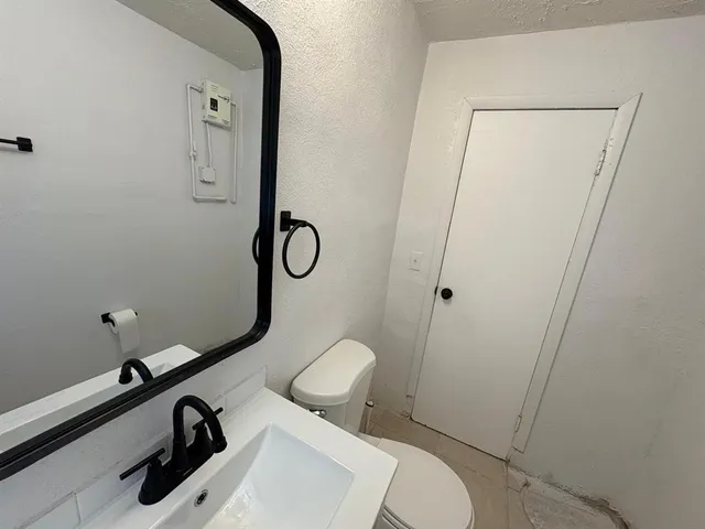 a bathroom with a toilet and a sink