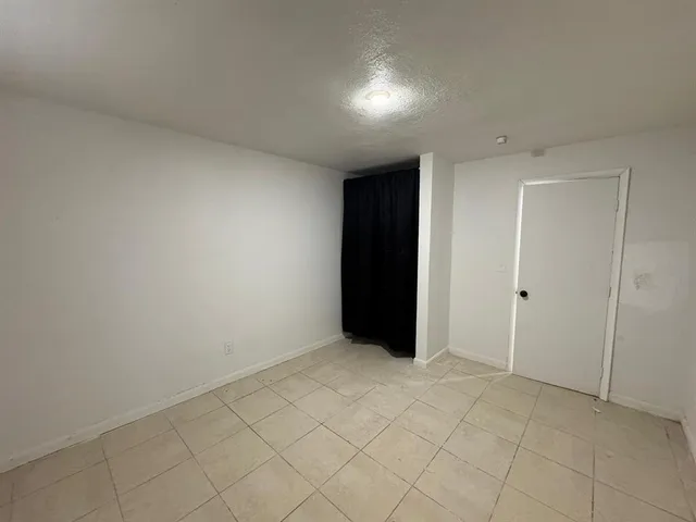 a bathroom with a toilet a sink and bathtub