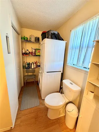 a bathroom with a toilet and a shower curtain
