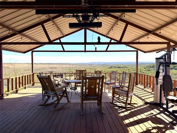 a view of a chairs and table in the balcony