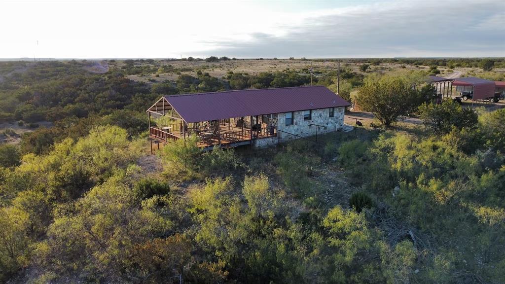 5530 Highway 158 Bronte, TX 76933 - Photo 2 of 40 an aerial view of a house with a yard