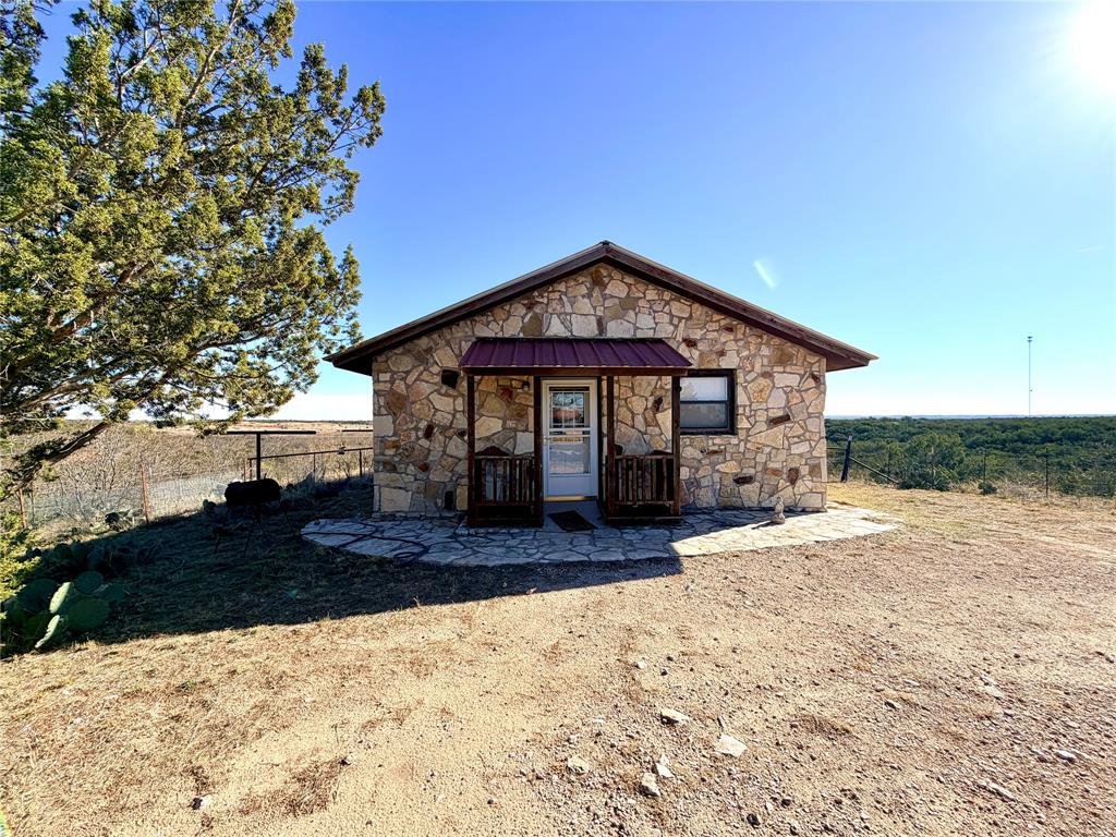 5530 Highway 158 Bronte, TX 76933 - Photo 22 of 40 a front view of a house with a yard