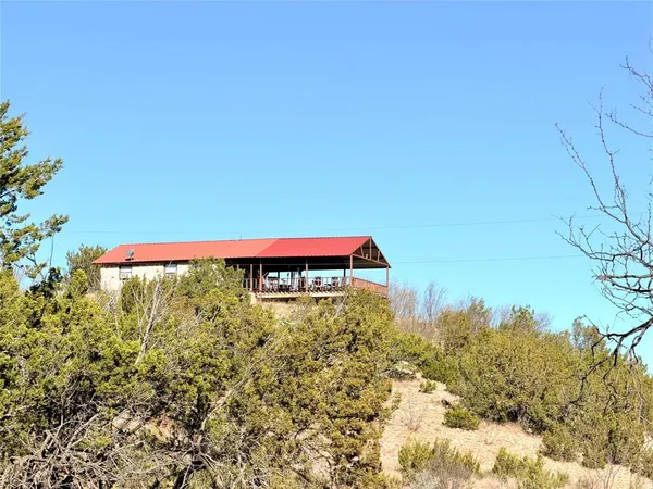 a sign that is sitting in front of a house
