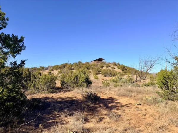 a view of a snow with a mountain in the background