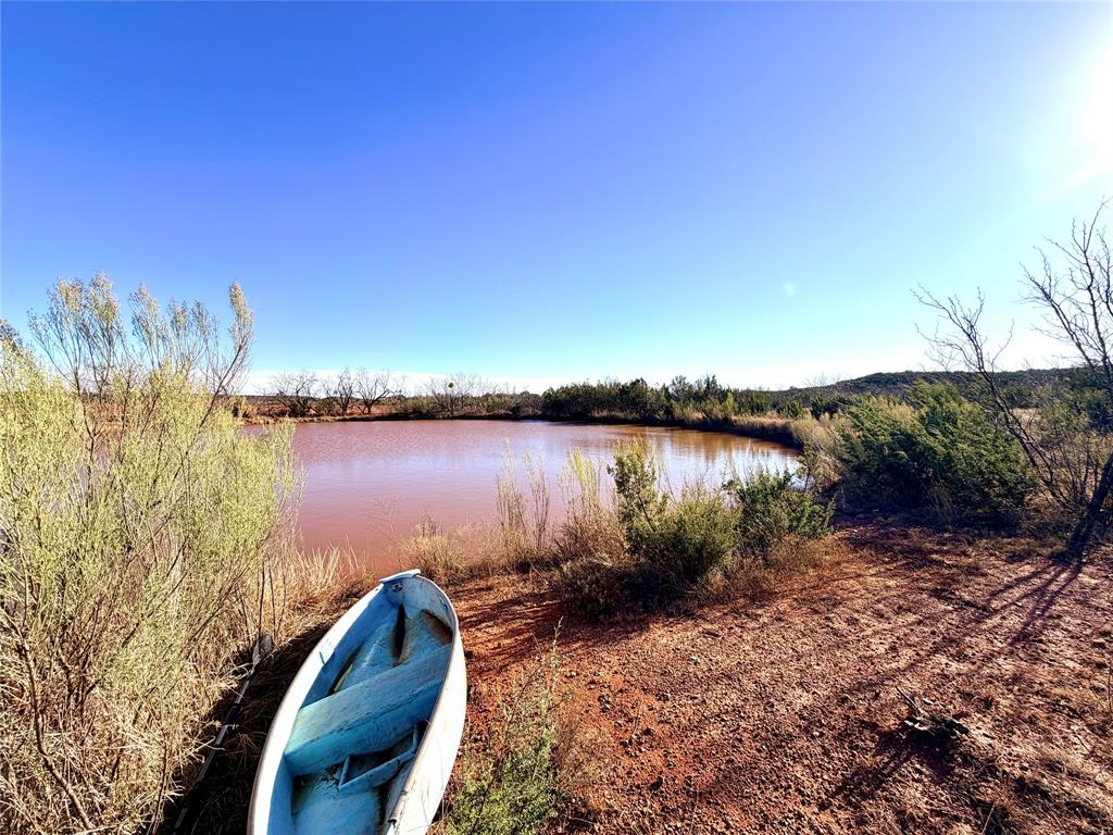 5530 Highway 158 Bronte, TX 76933 - Photo 38 of 40 a view of a lake from a yard