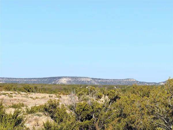 a view of ocean and mountain
