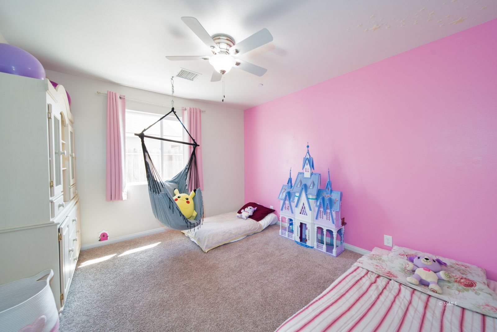 1540 Mayo Street Ridgecrest, CA 93555 - Photo 15 of 32 a bedroom with furniture and a chandelier