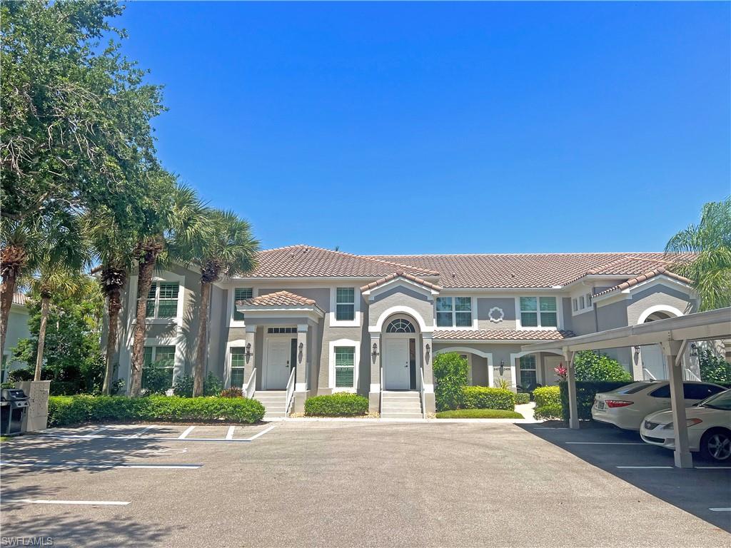 9261 Spring Run Boulevard, Unit 2407 Estero, FL 34135 - Photo 14 of 24 Front of home with a carport