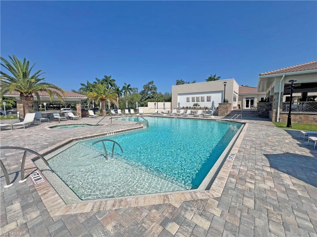 9261 Spring Run Boulevard, Unit 2407 Estero, FL 34135 - Photo 22 of 24 Clubhouse pool and spa