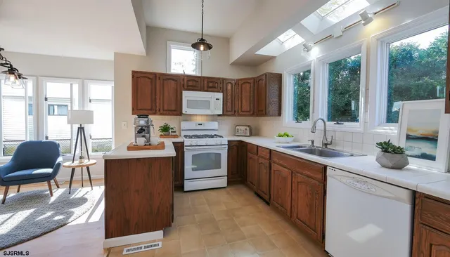 a kitchen with a sink stove and microwave