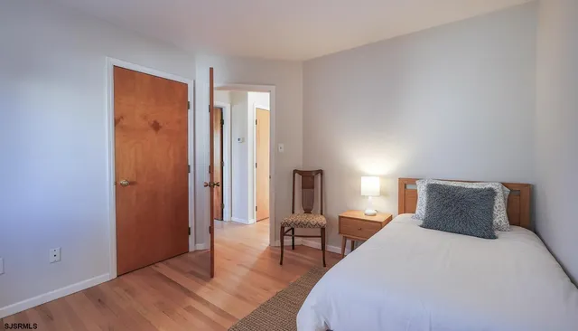 a bedroom with a bed and a table