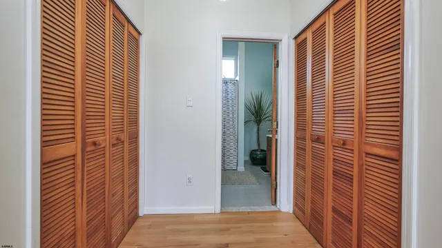 a view of a bathroom from a hallway