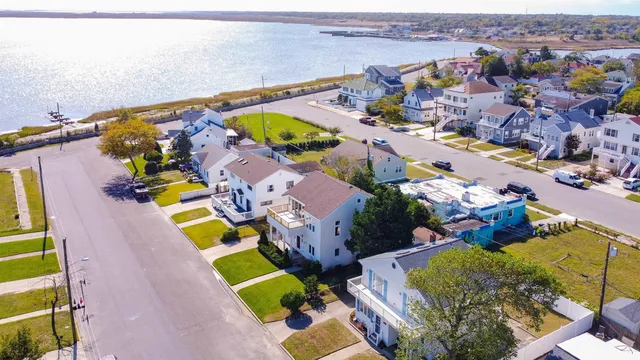 an aerial view of a house with a swimming pool yard and outdoor seating