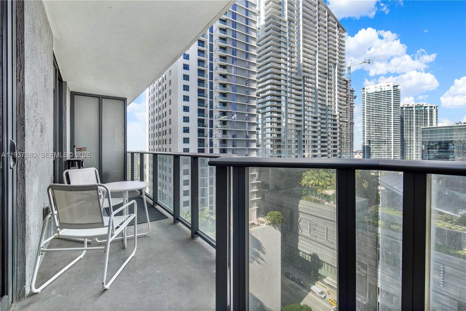 45 Southwest 9th Street, Unit 1609 Miami, FL 33130 - Photo 20 of 39 a view of a balcony with chairs