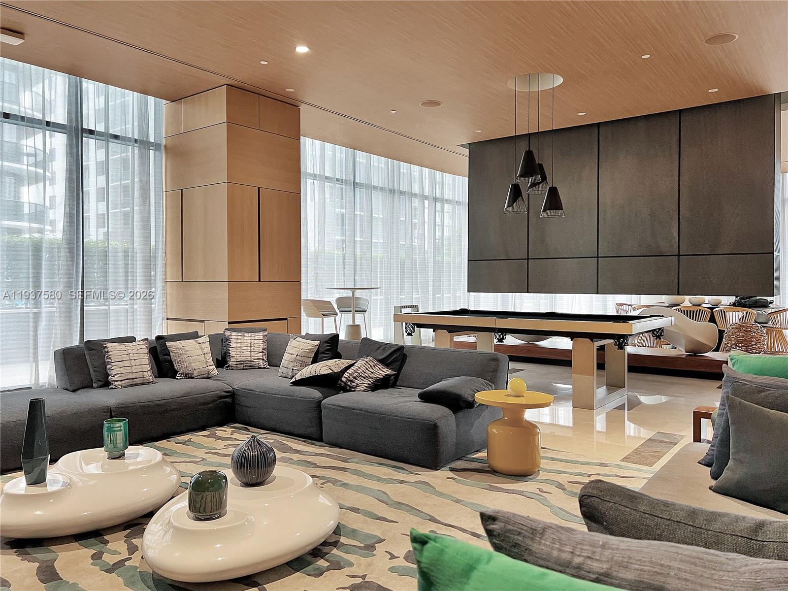 45 Southwest 9th Street, Unit 1609 Miami, FL 33130 - Photo 23 of 39 a living room with furniture and a large window