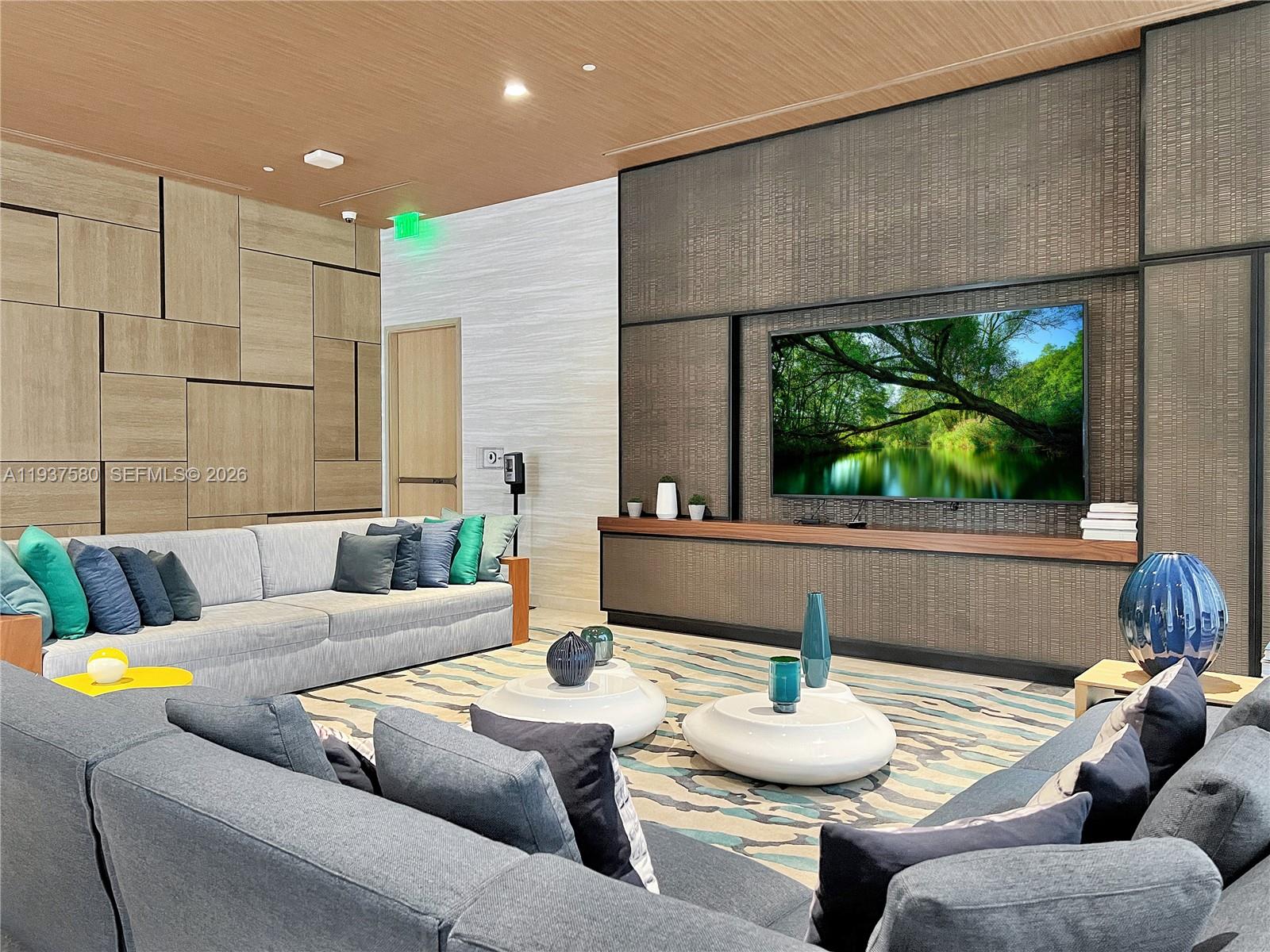 45 Southwest 9th Street, Unit 1609 Miami, FL 33130 - Photo 24 of 39 a living room with furniture and a floor to ceiling window