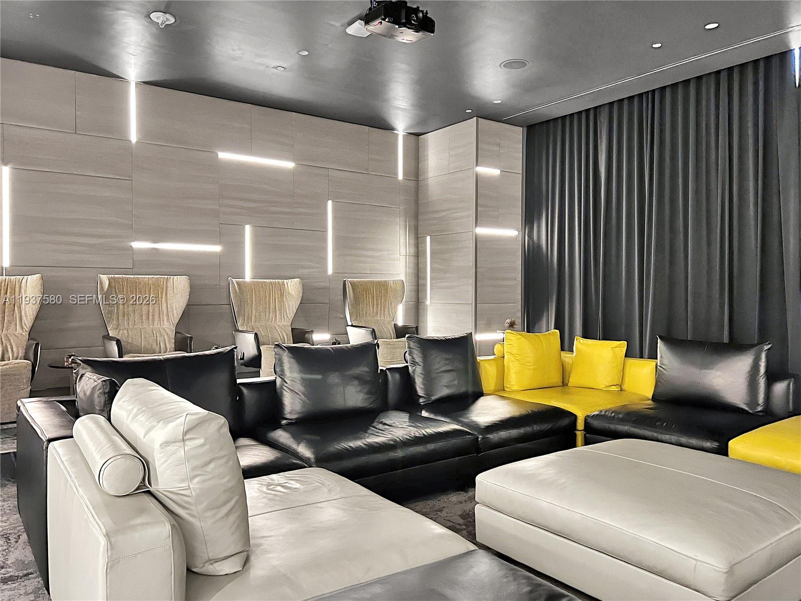 45 Southwest 9th Street, Unit 1609 Miami, FL 33130 - Photo 34 of 39 a lobby with furniture and two mirrors