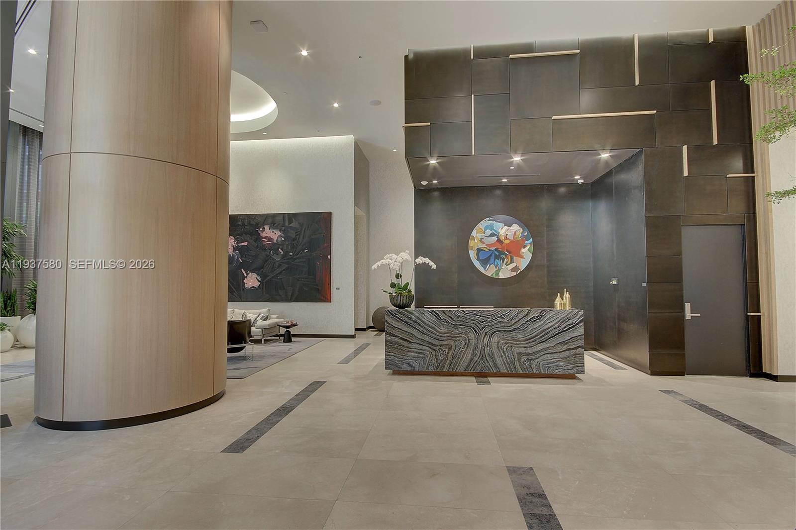 45 Southwest 9th Street, Unit 1609 Miami, FL 33130 - Photo 36 of 39 a living room with furniture and a table