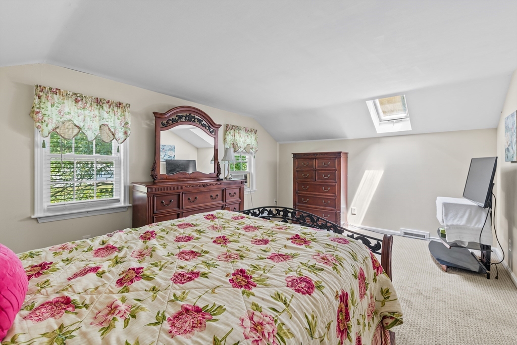 450 Skunknet Road Barnstable, MA 02632 - Photo 17 of 42 a bedroom with a bed and a large window