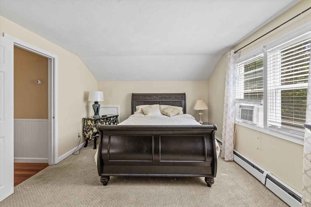 450 Skunknet Road Barnstable, MA 02632 - Photo 19 of 42 a bedroom with a bed and a window
