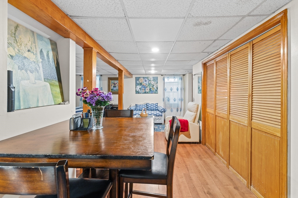 450 Skunknet Road Barnstable, MA 02632 - Photo 23 of 42 a dining room with furniture and wooden floor