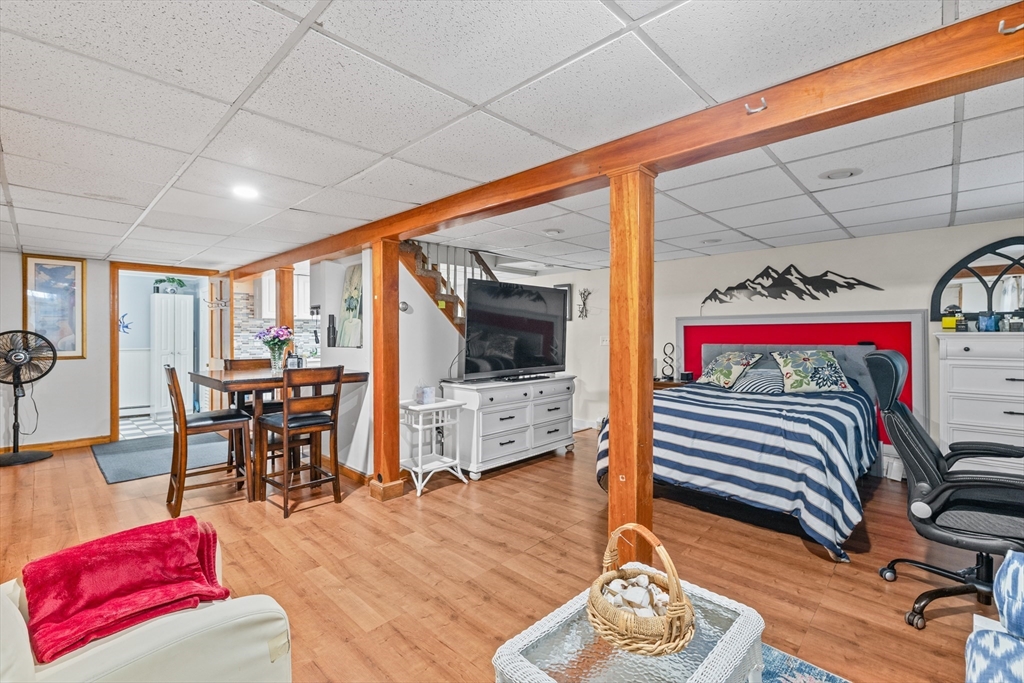 450 Skunknet Road Barnstable, MA 02632 - Photo 24 of 42 a living room with furniture and a flat screen tv