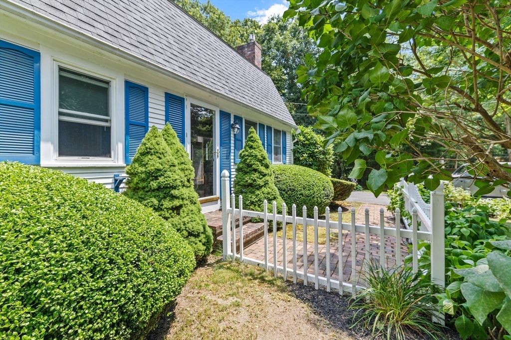 450 Skunknet Road Barnstable, MA 02632 - Photo 31 of 42 a view of house with a flower garden