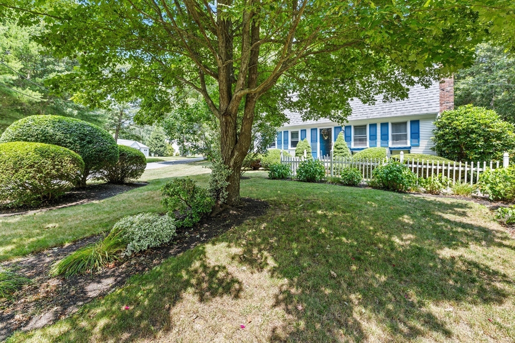 450 Skunknet Road Barnstable, MA 02632 - Photo 32 of 42 a front view of a house with a garden