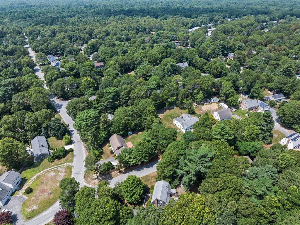 450 Skunknet Road Barnstable, MA 02632 - Photo 42 of 42 an aerial view of residential house with outdoor space and trees all around