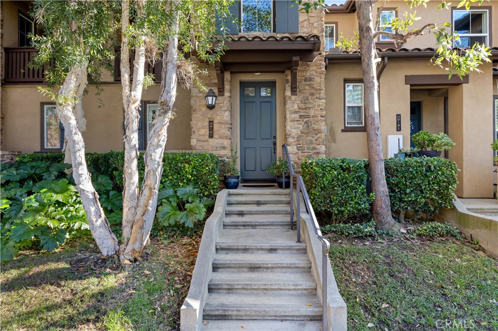 122 Jadestone Irvine, CA 92603 - Photo 1 of 20 a view of a pathway of a house with potted plants