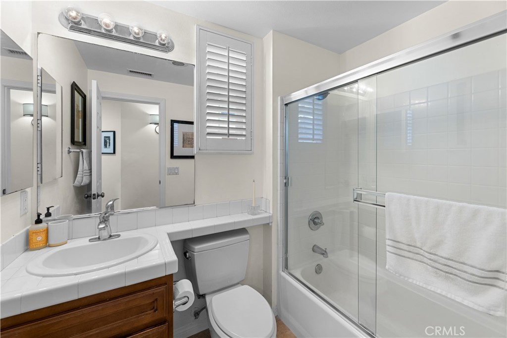122 Jadestone Irvine, CA 92603 - Photo 13 of 20 a bathroom with a sink toilet and shower