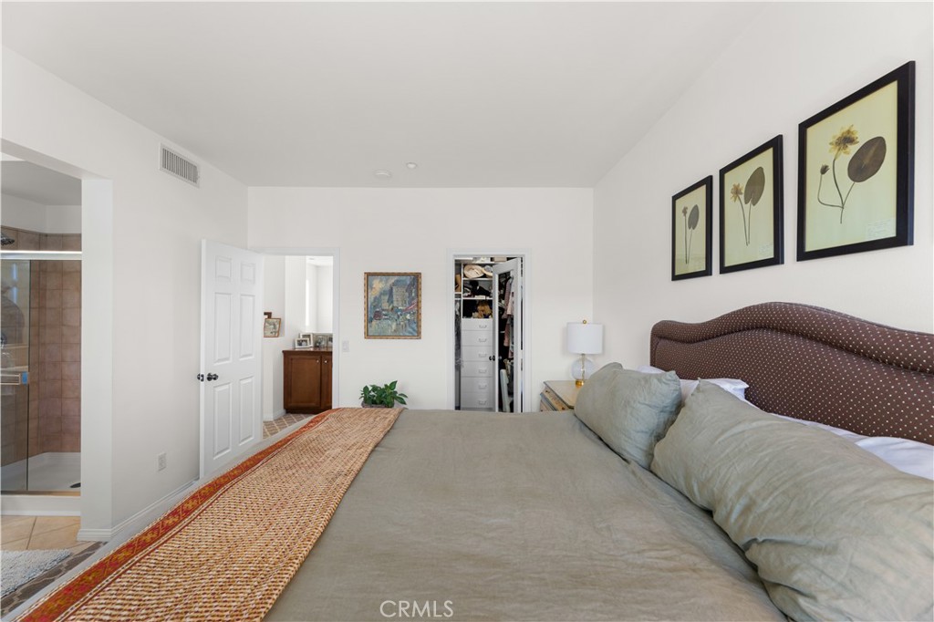 122 Jadestone Irvine, CA 92603 - Photo 16 of 20 a bed room with a bed mirror and a window