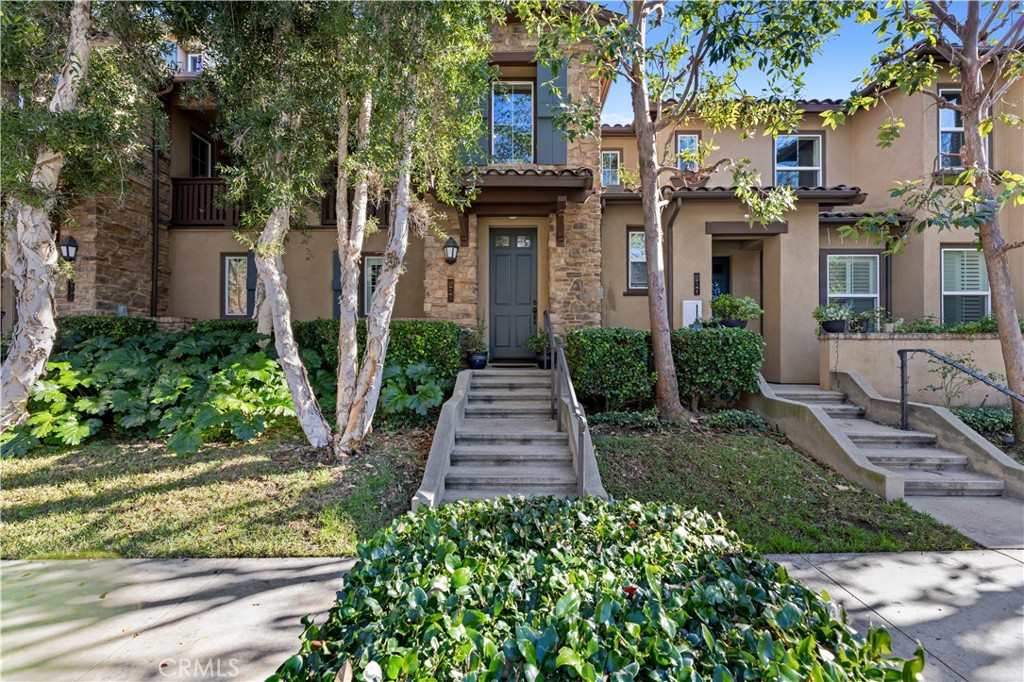 122 Jadestone Irvine, CA 92603 - Photo 20 of 20 front view of a brick house with a yard