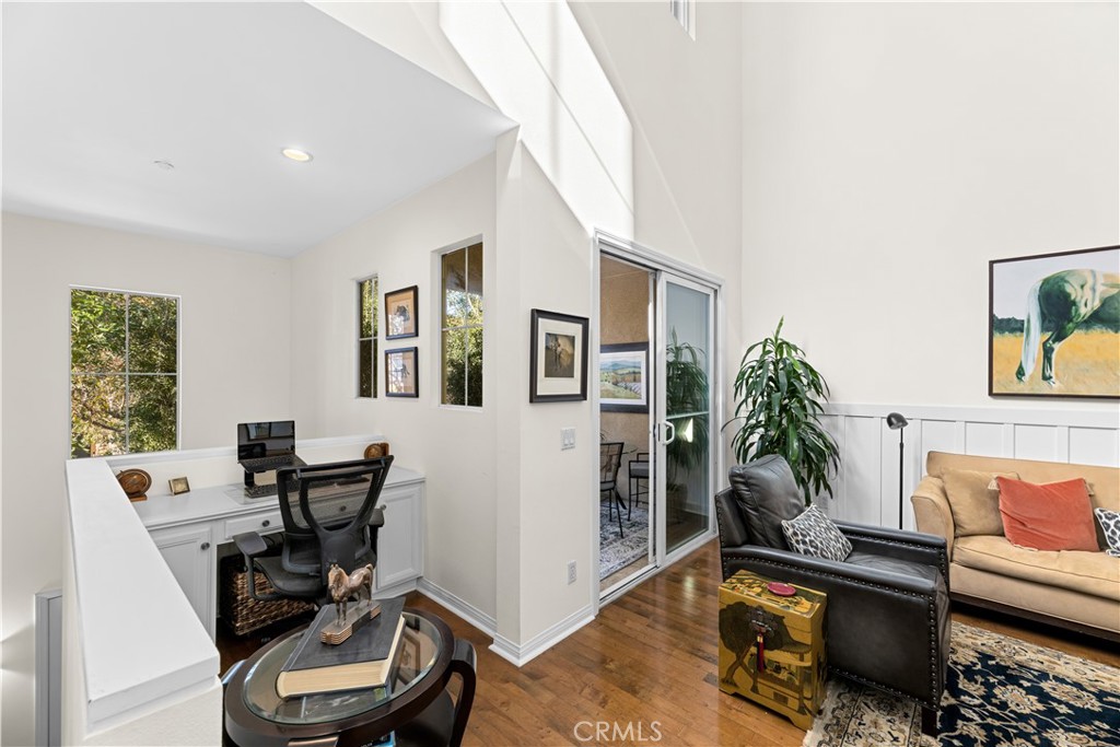 122 Jadestone Irvine, CA 92603 - Photo 5 of 20 a living room with furniture and a wooden floor