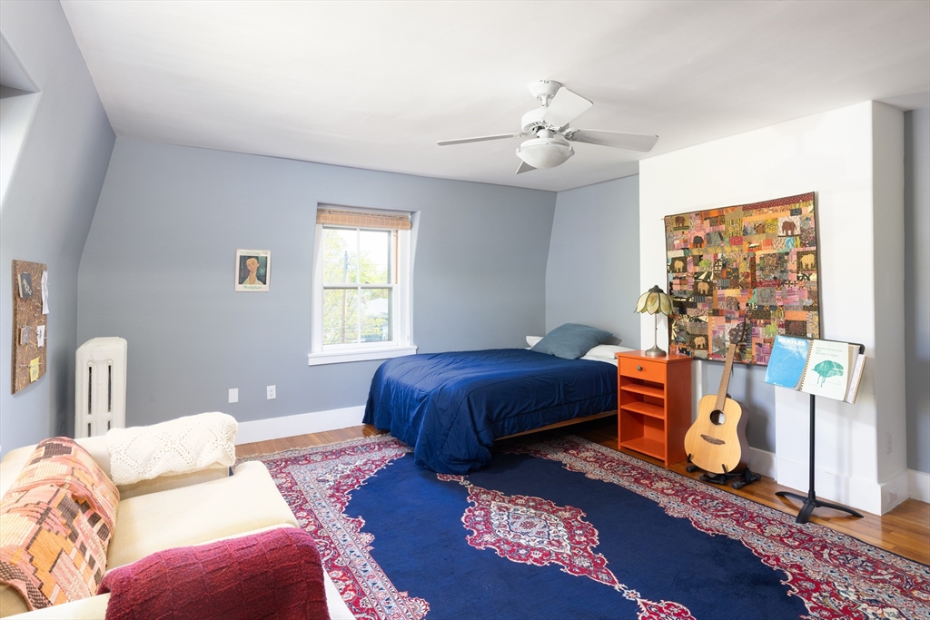 135 Langley Road Newton, MA 02459 - Photo 17 of 20 a bedroom with bed and window