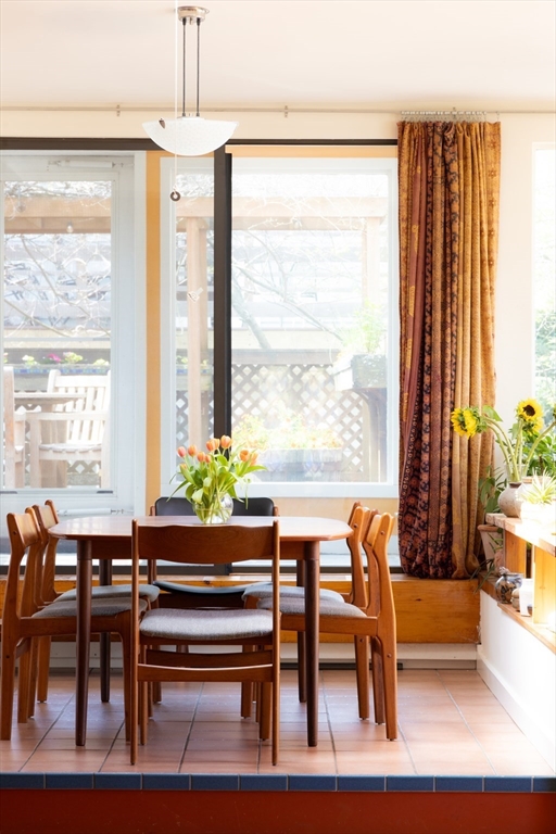 135 Langley Road Newton, MA 02459 - Photo 3 of 20 a view of a dining room with furniture window and outside view