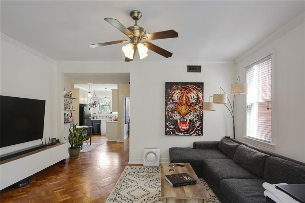 872 Briarcliff Road Northeast, Unit B3 Atlanta, GA 30306 - Photo 1 of 1 a living room with furniture and a flat screen tv