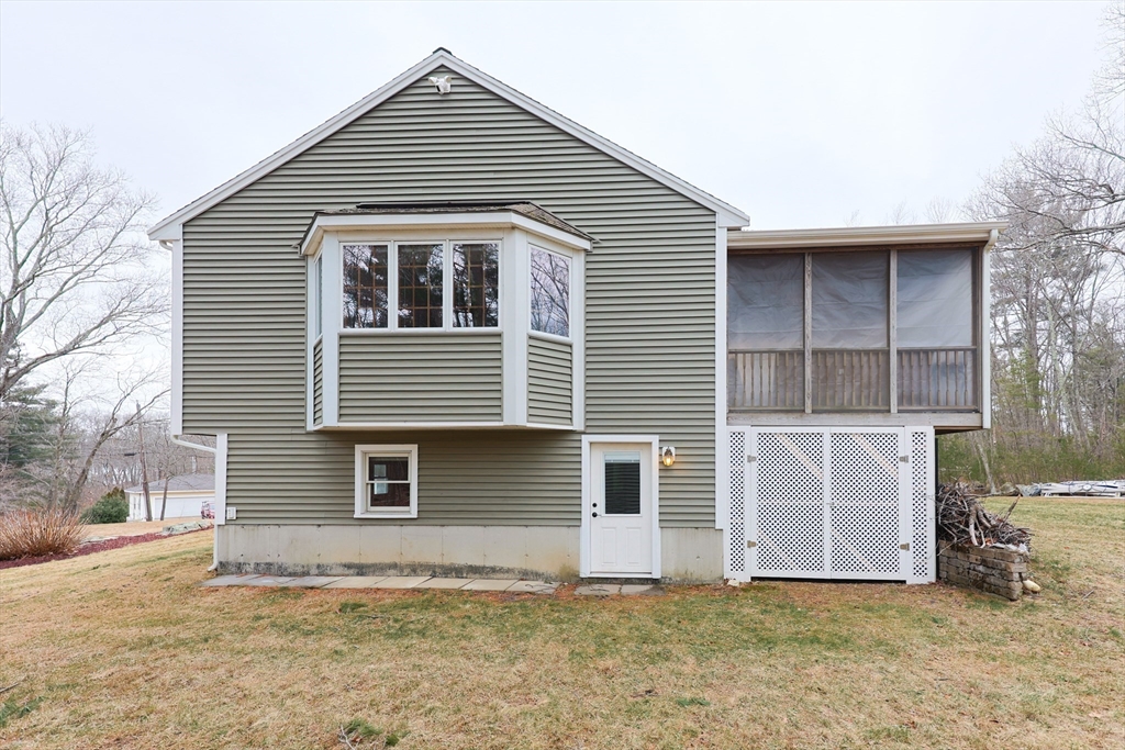 68 Greene Street, Unit A Hopedale, MA 01747 - Photo 24 of 26 a view of a house with a yard