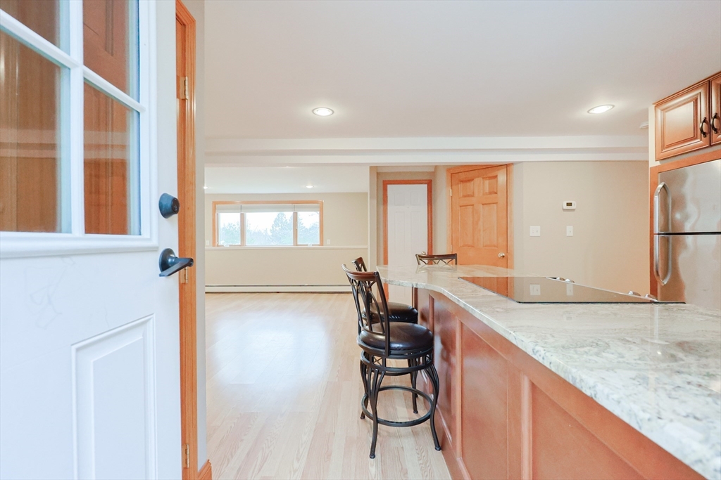 68 Greene Street, Unit A Hopedale, MA 01747 - Photo 3 of 26 a view of a kitchen with a sink and cabinets