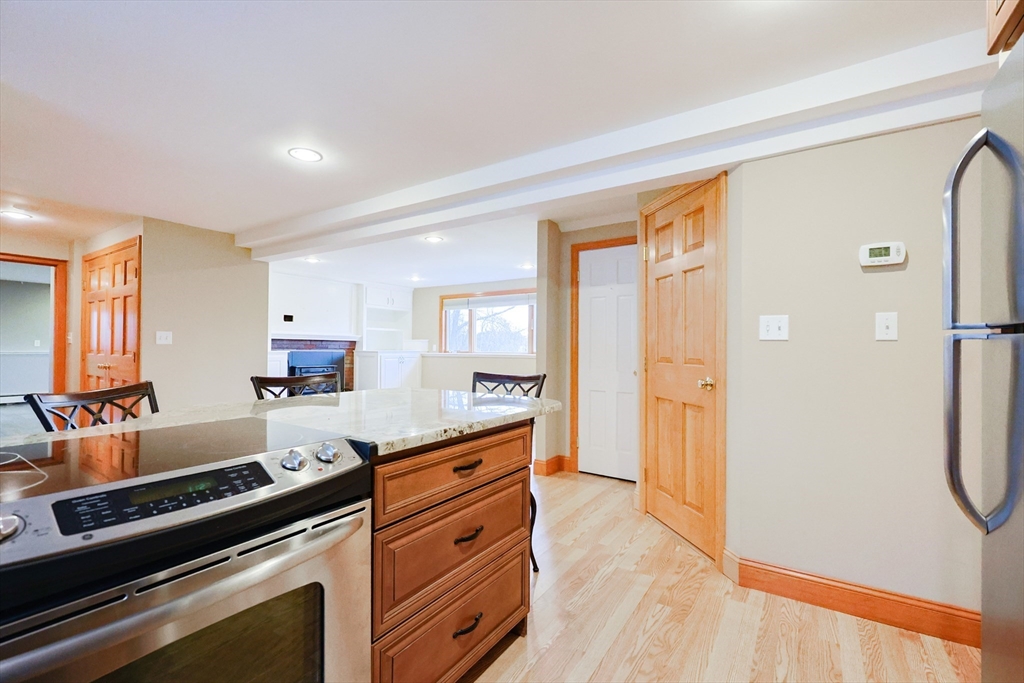 68 Greene Street, Unit A Hopedale, MA 01747 - Photo 7 of 26 a kitchen with stainless steel appliances a stove and a refrigerator
