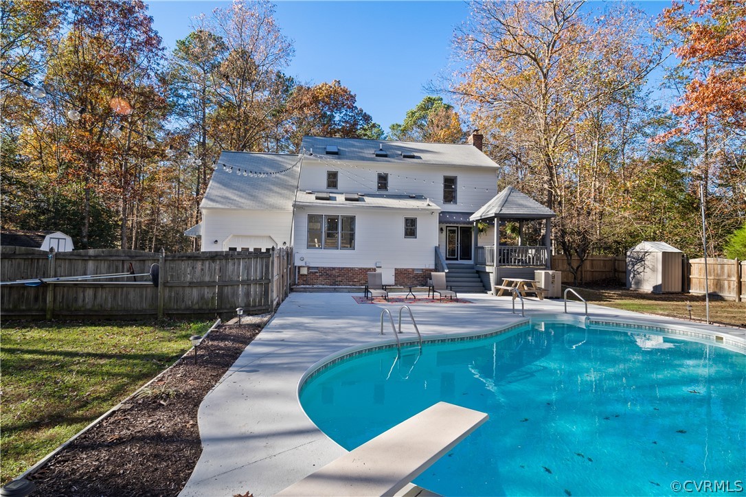 13441 Bailey Bridge Road Midlothian, VA 23112 - Photo 41 of 48 a view of a house with swimming pool and sitting area