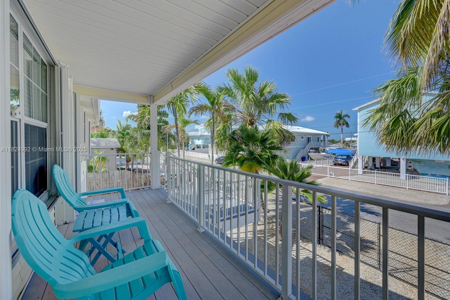 239 Lower Matecumbe Road Key Largo, FL 33037 - Photo 38 of 70 a view of balcony with furniture and wooden deck