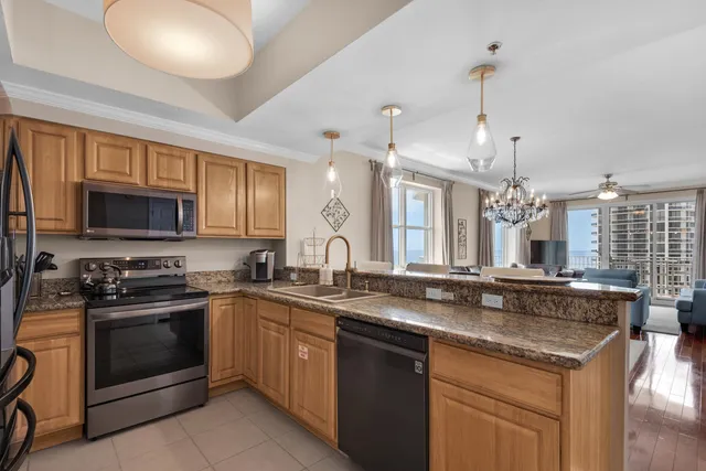 a kitchen with a sink stove and microwave