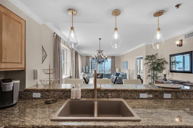 a kitchen with sink refrigerator and cabinets